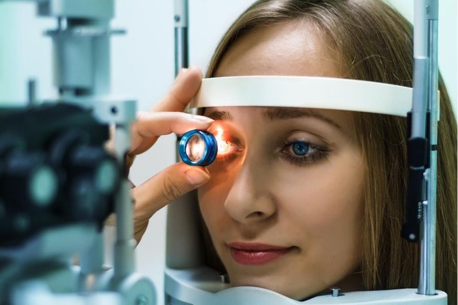 photo of woman getting an eye exam